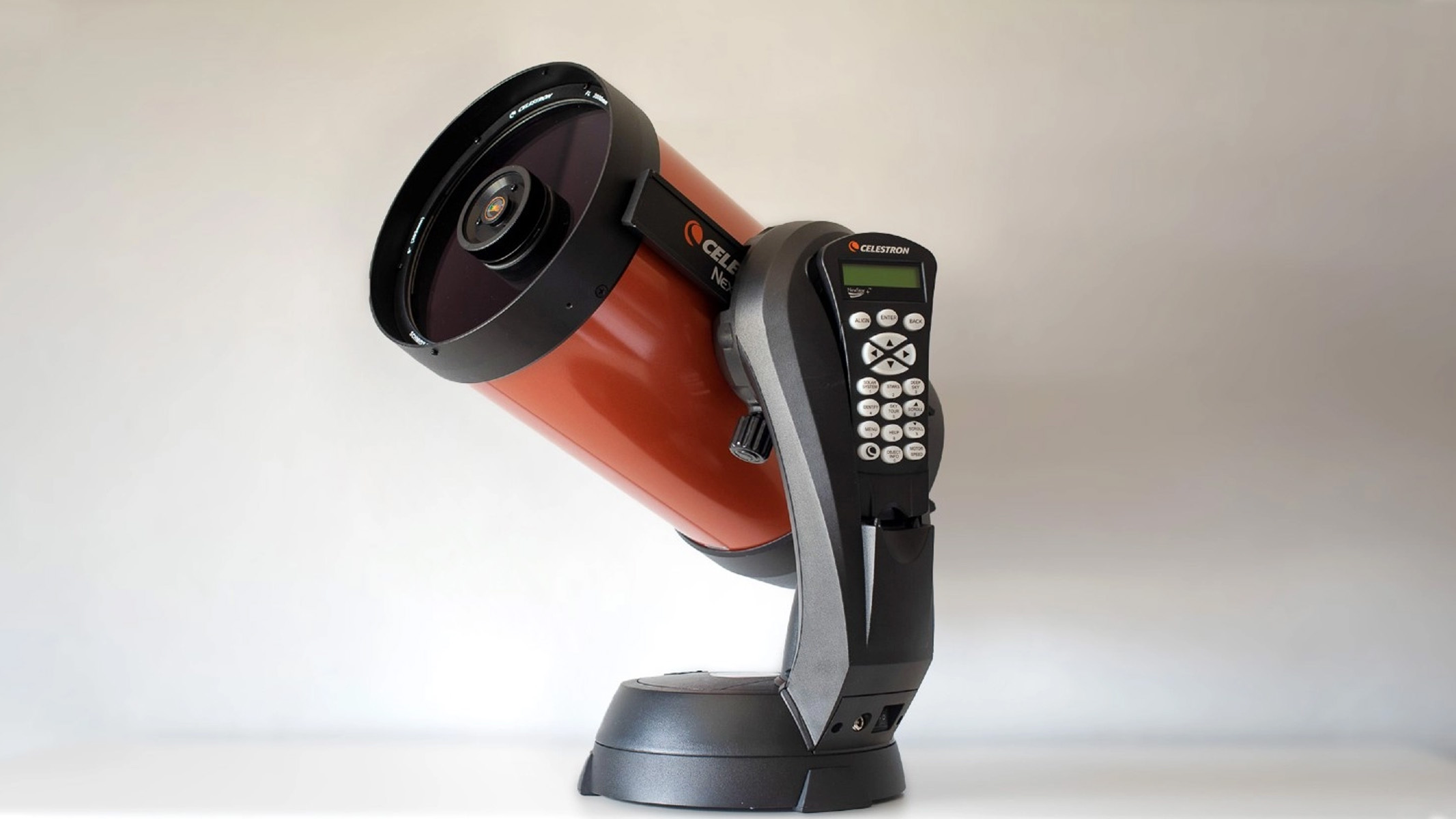 Celestron 8SE against a white wall